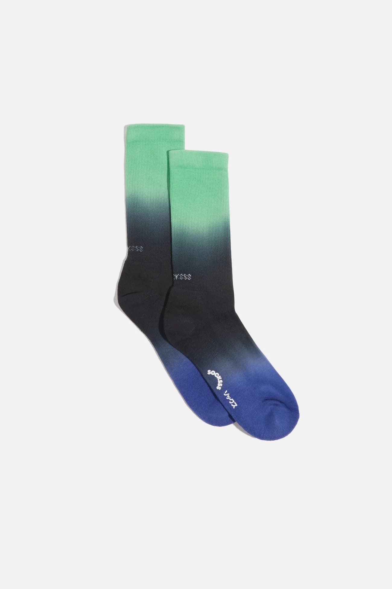 Packshot chaussettes de surf dégradées vert noir et violet