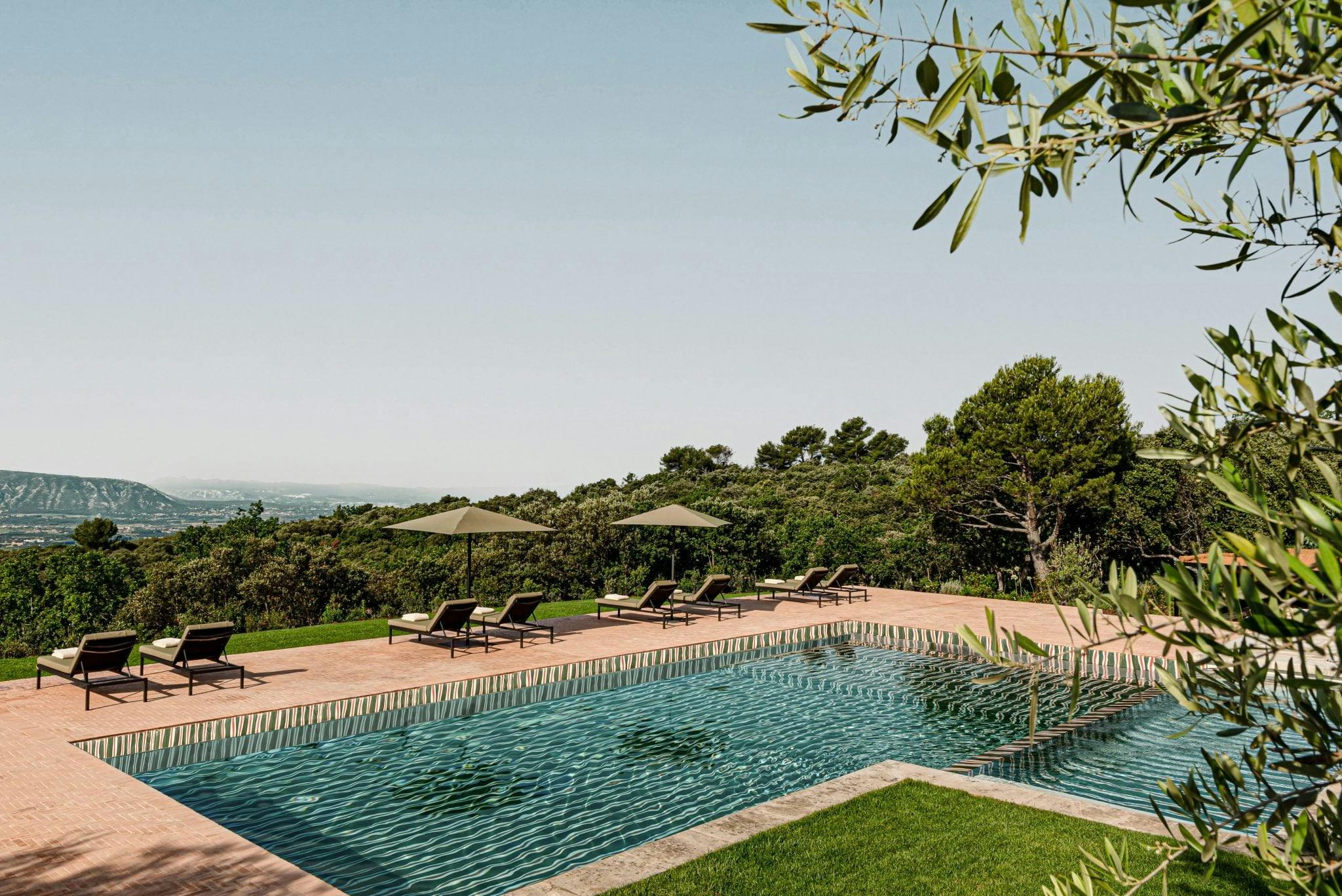 The pool and the 100% unobstructed view, sky view, deckchairs arranged to enhance the view at Hauts de Gordes.