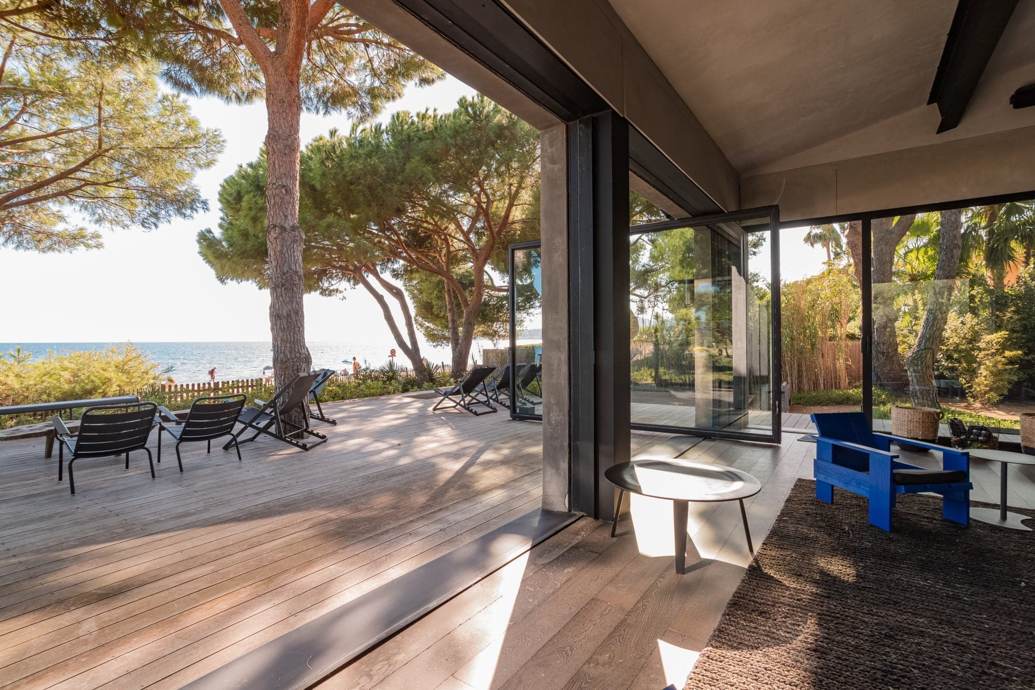 living room bathed in sunshine from the villa's large bay windows