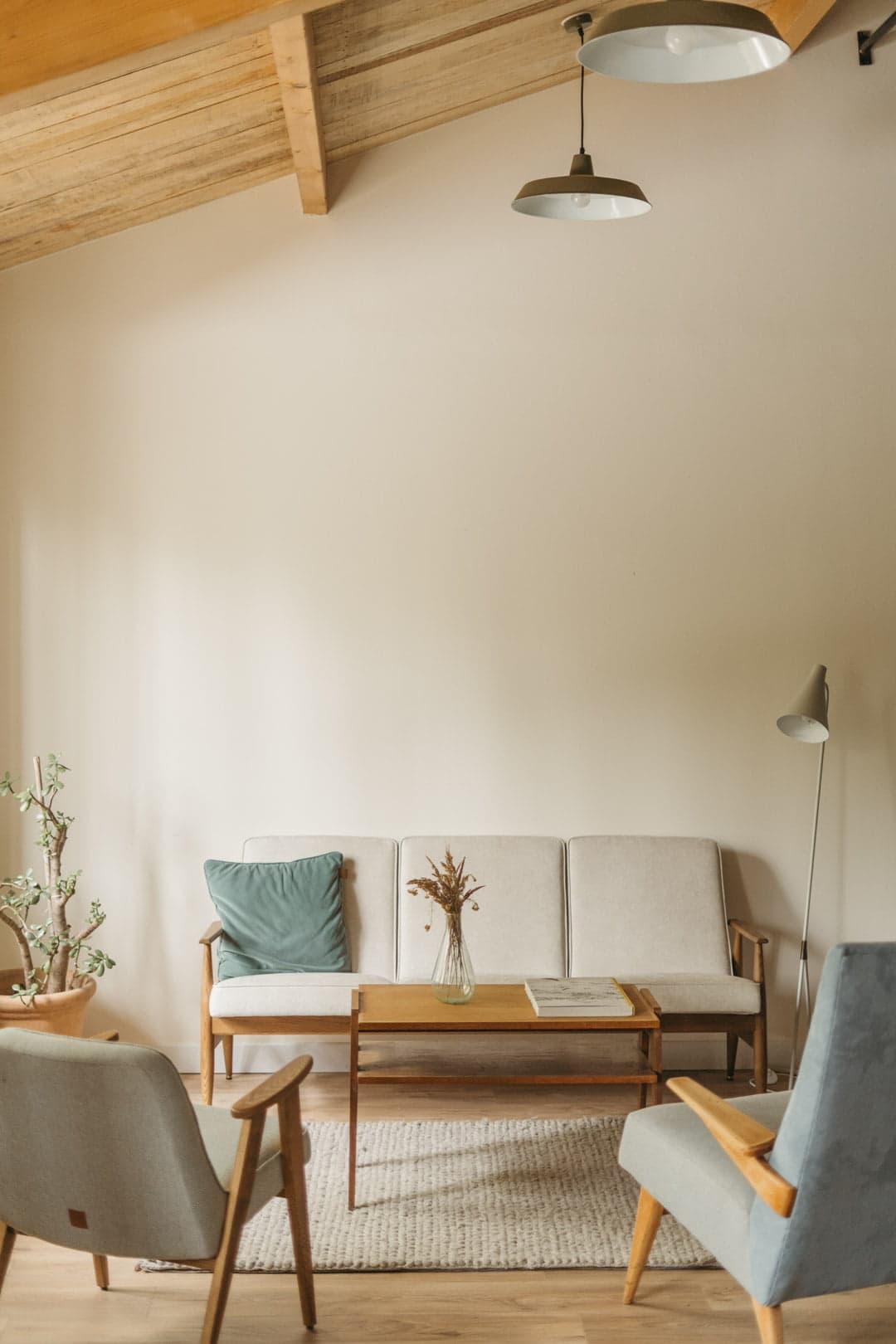 living room with sofa and armchair