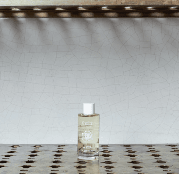 falon of camellia oil on a grey background