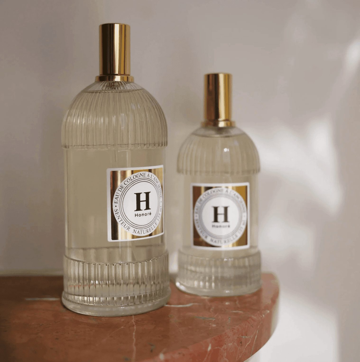 two glass bottles of eau de cologne