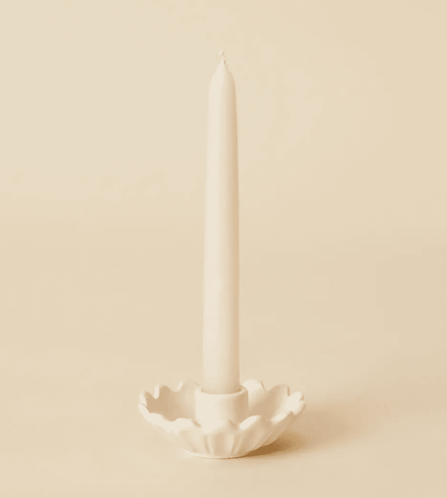 white ceramic candleholder with candle