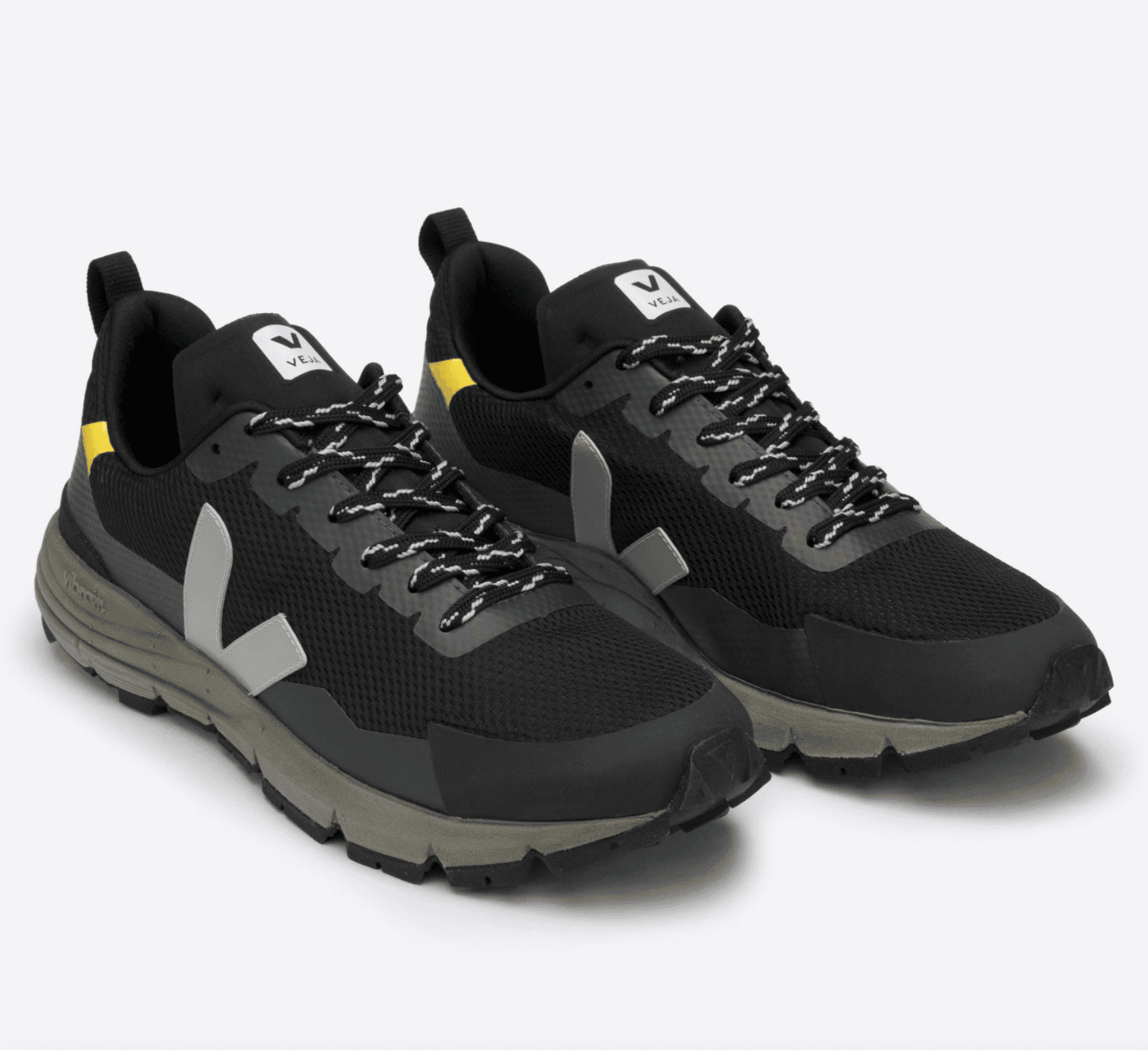 black sneakers with a grey v
