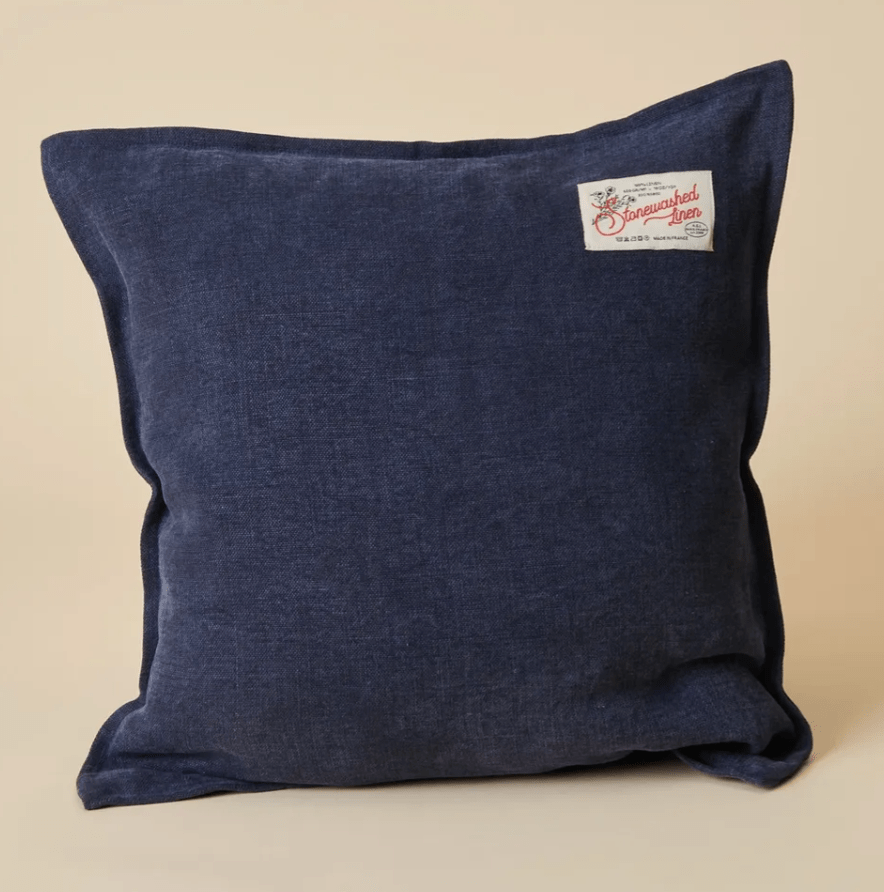blue cushion with a beige background