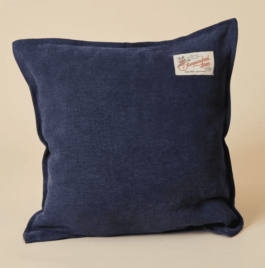 blue cushion with a beige background