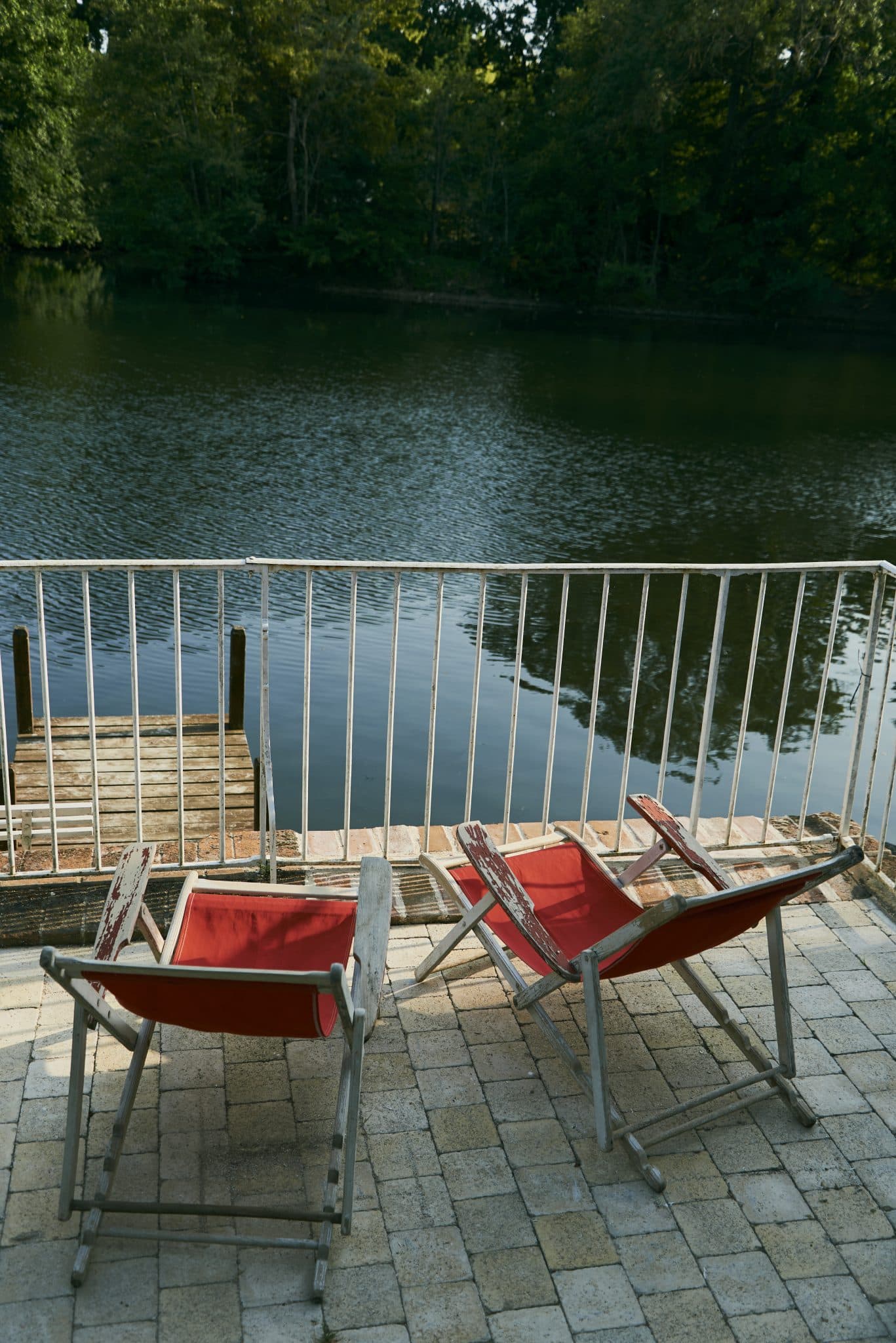 red deckchairs by the lake