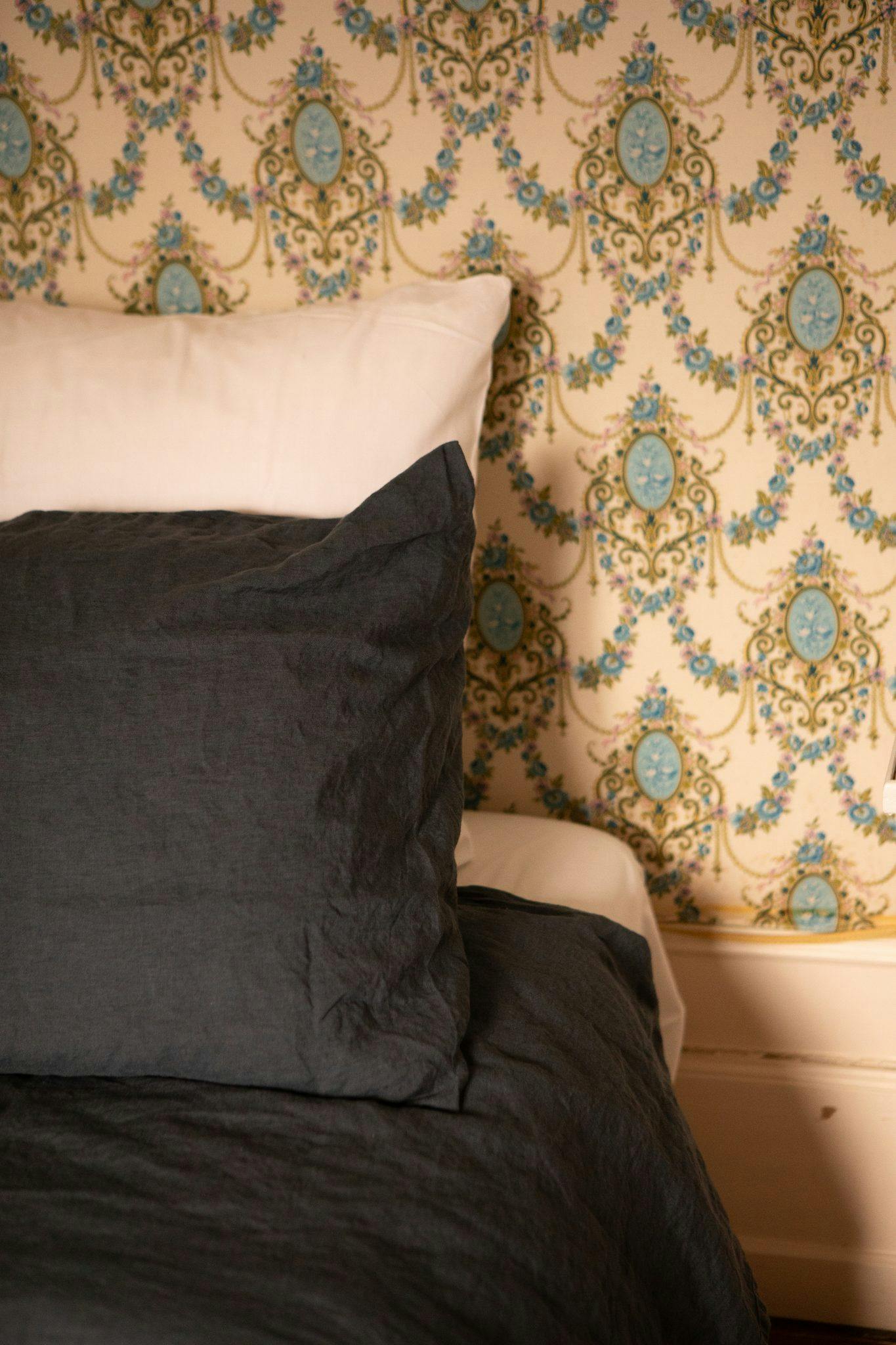 bedroom details, cushion and wallpaper