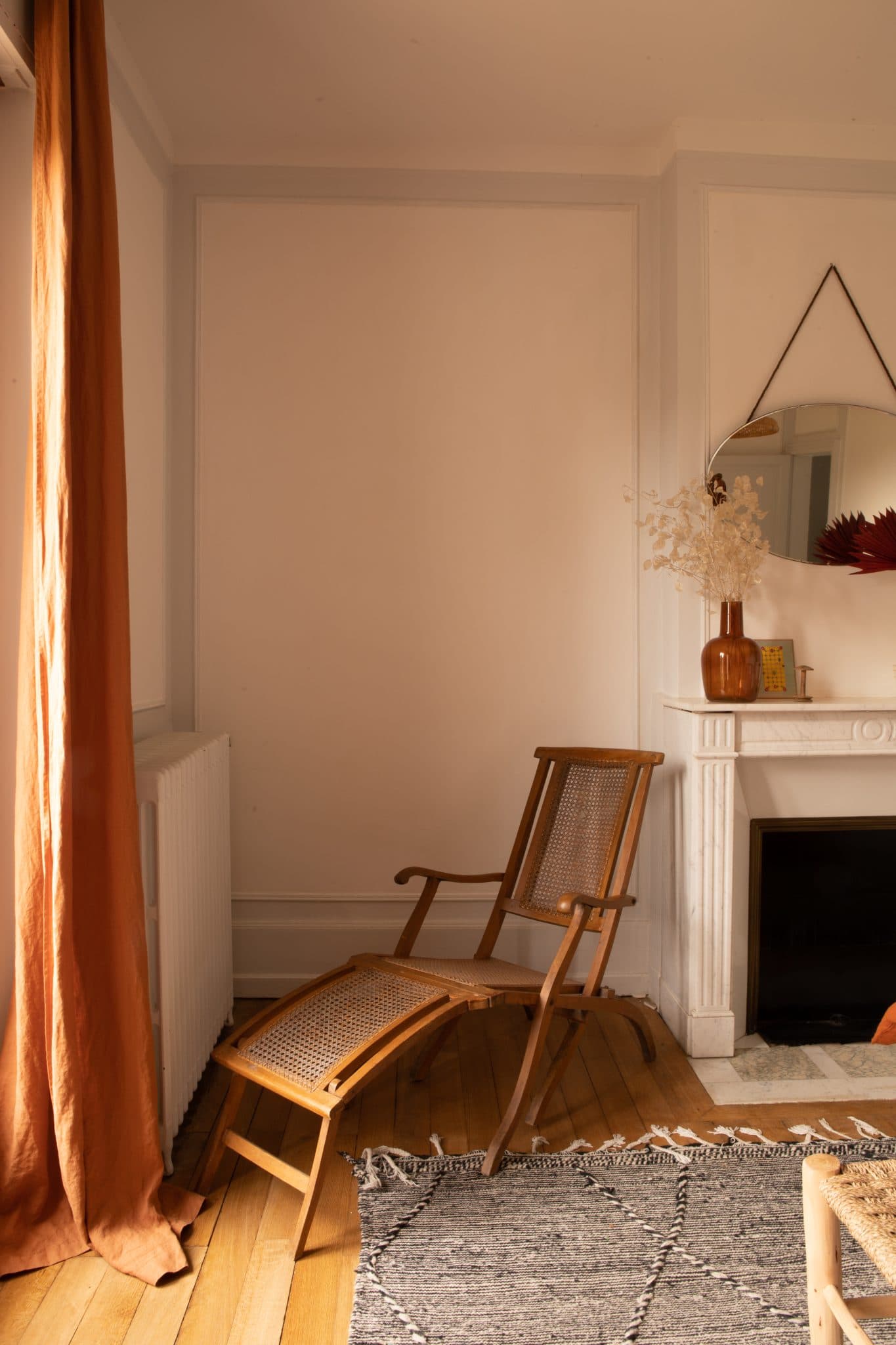 An instant love affair: a chic, thrifted wooden and caned lounge chair.