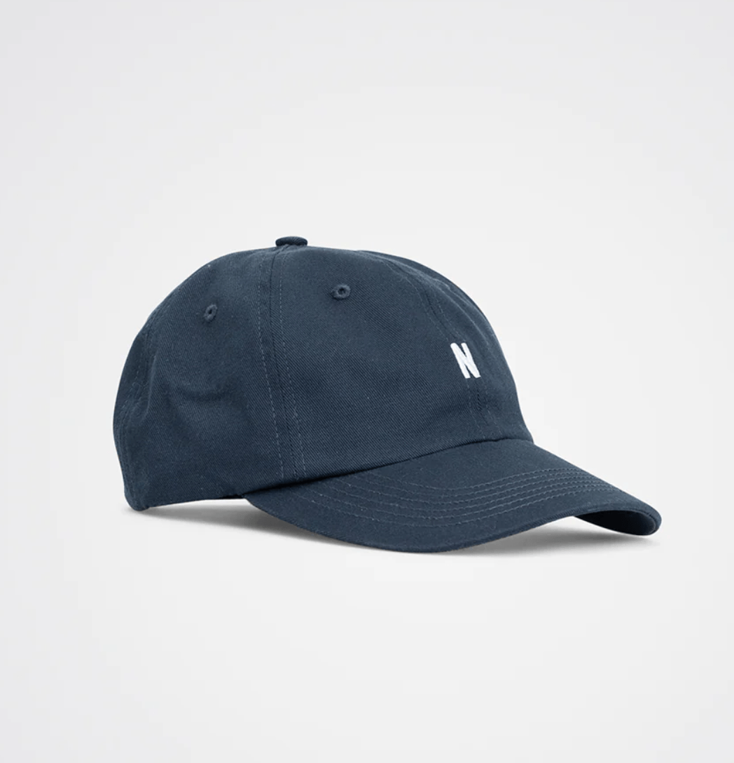 norse project blue cap with a N 