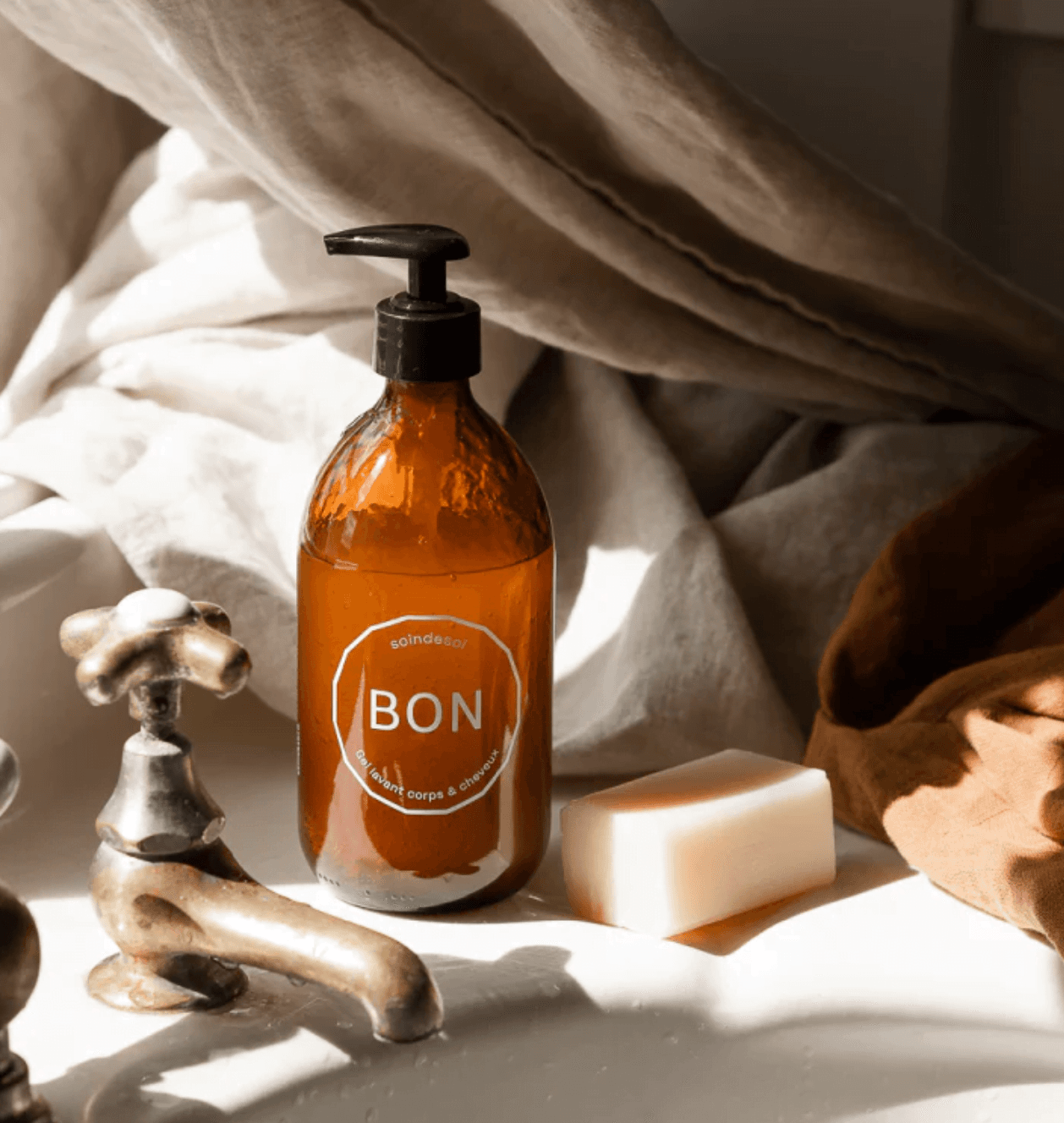 Hair and body wash around a tap