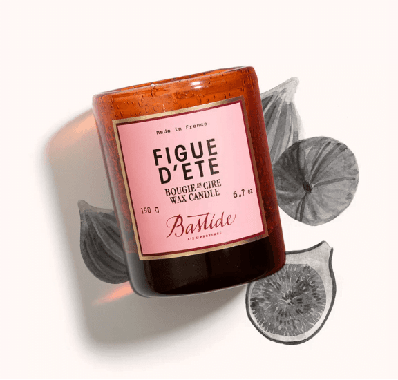 packshot of a wax candle with pink label