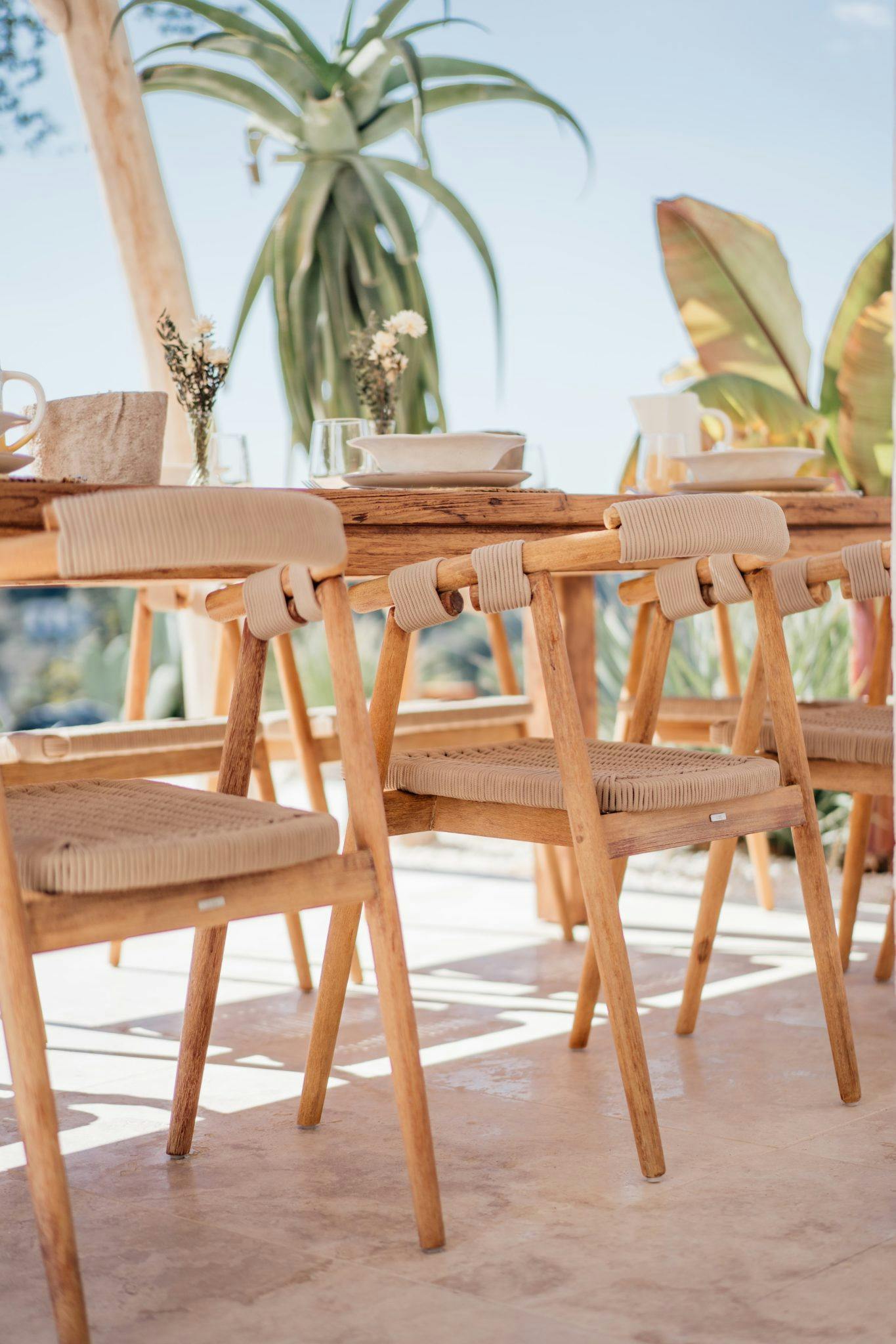 Focus on the chairs of the outdoor dining table