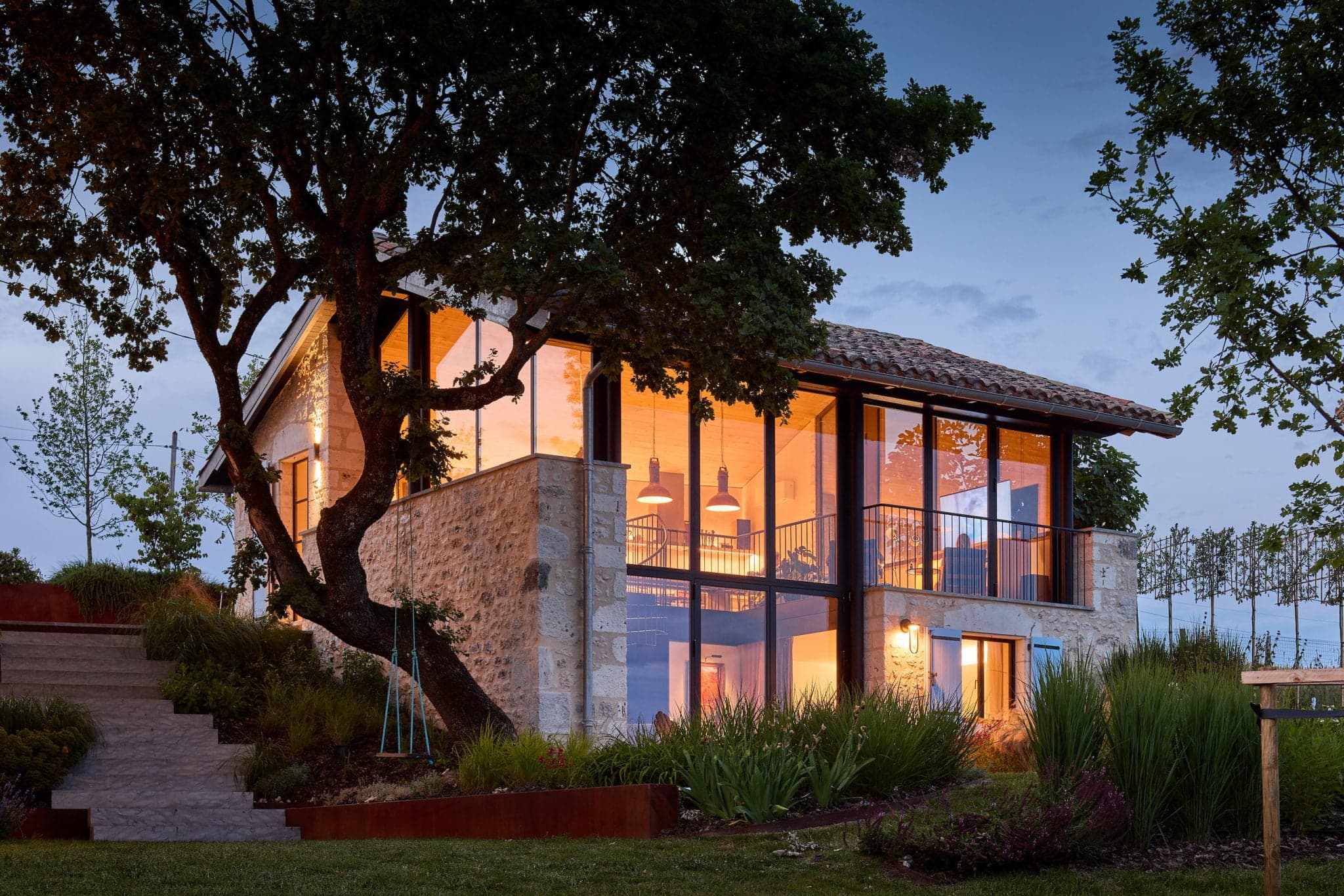 L'Atelier at dusk, illuminated from within