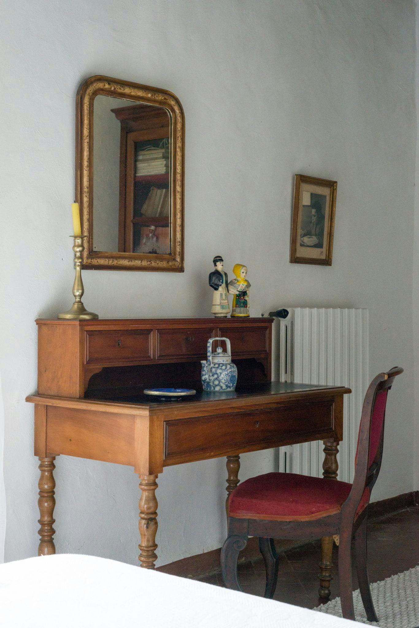 Antique-style desk and chair in one of the bedrooms