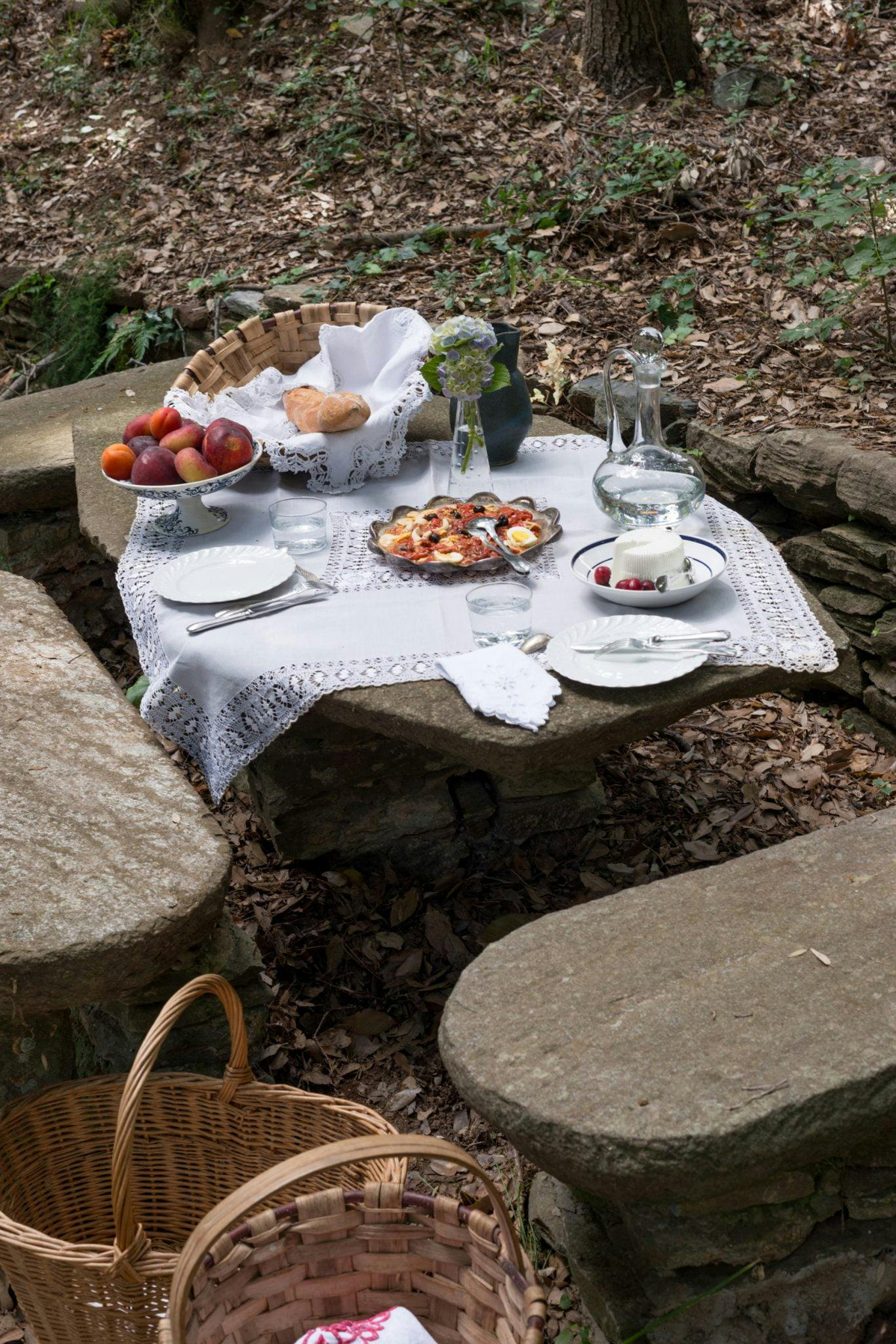 Garden table with tablecloth and dishes