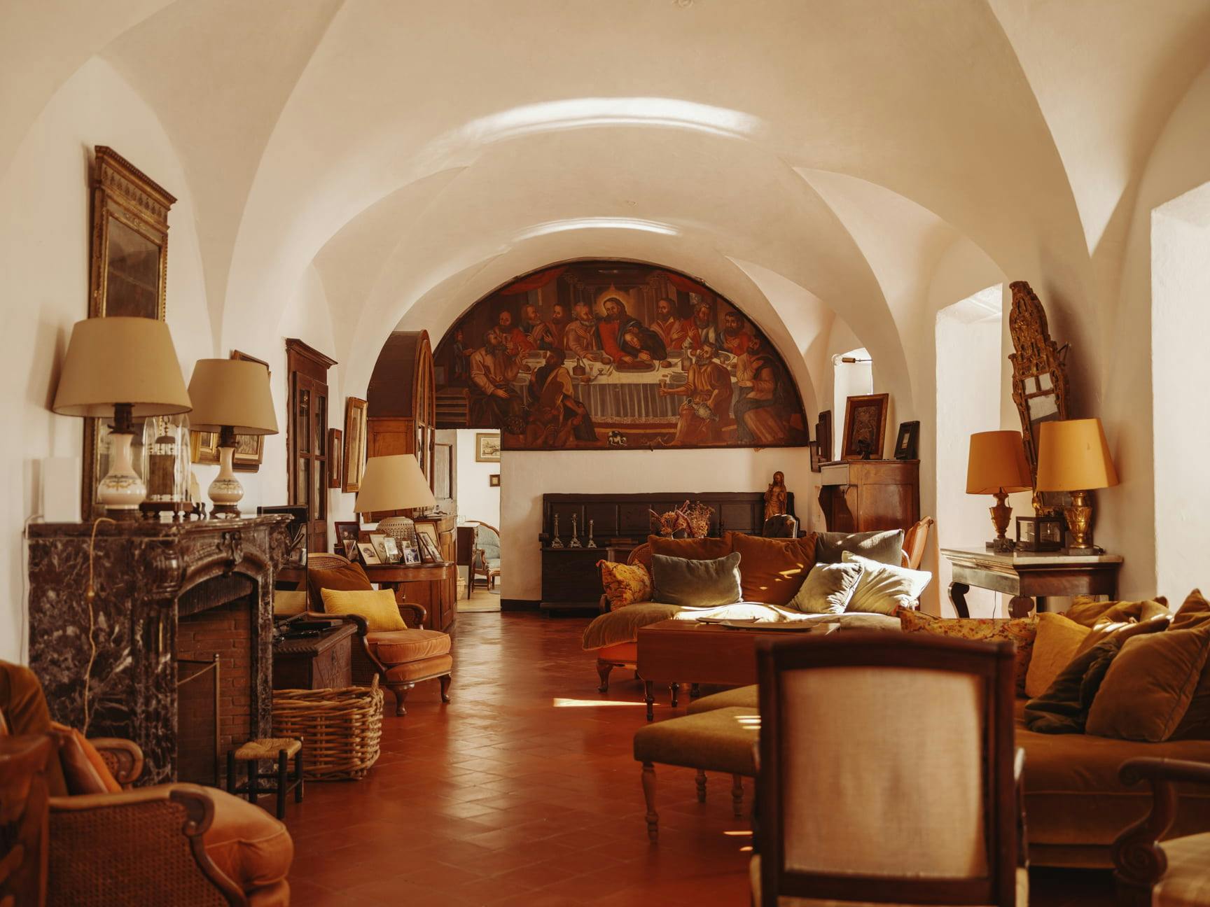Living room with period fresco depicting the scene