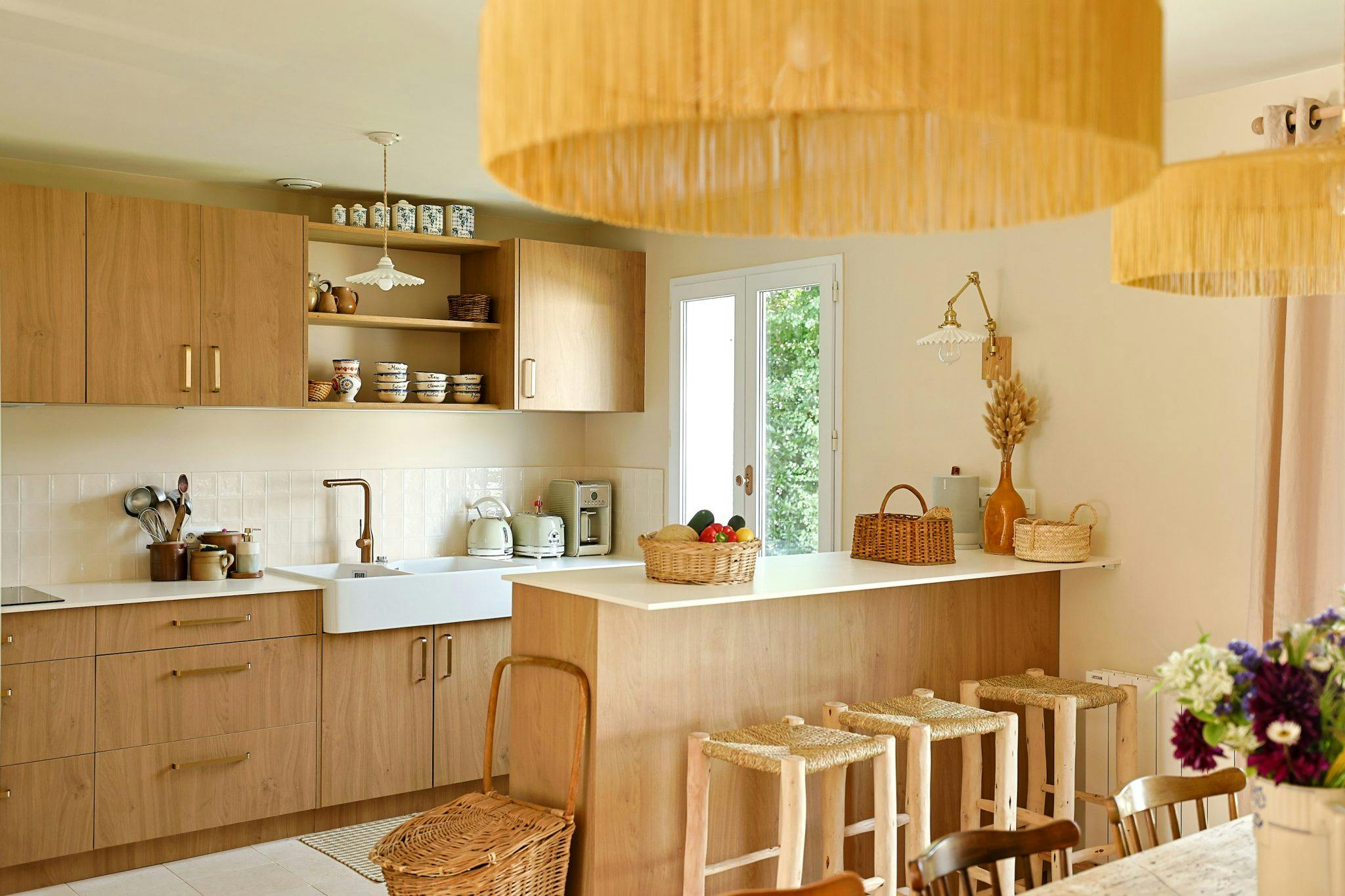 La Bien Aimée kitchen: modern and woody, bar and stools