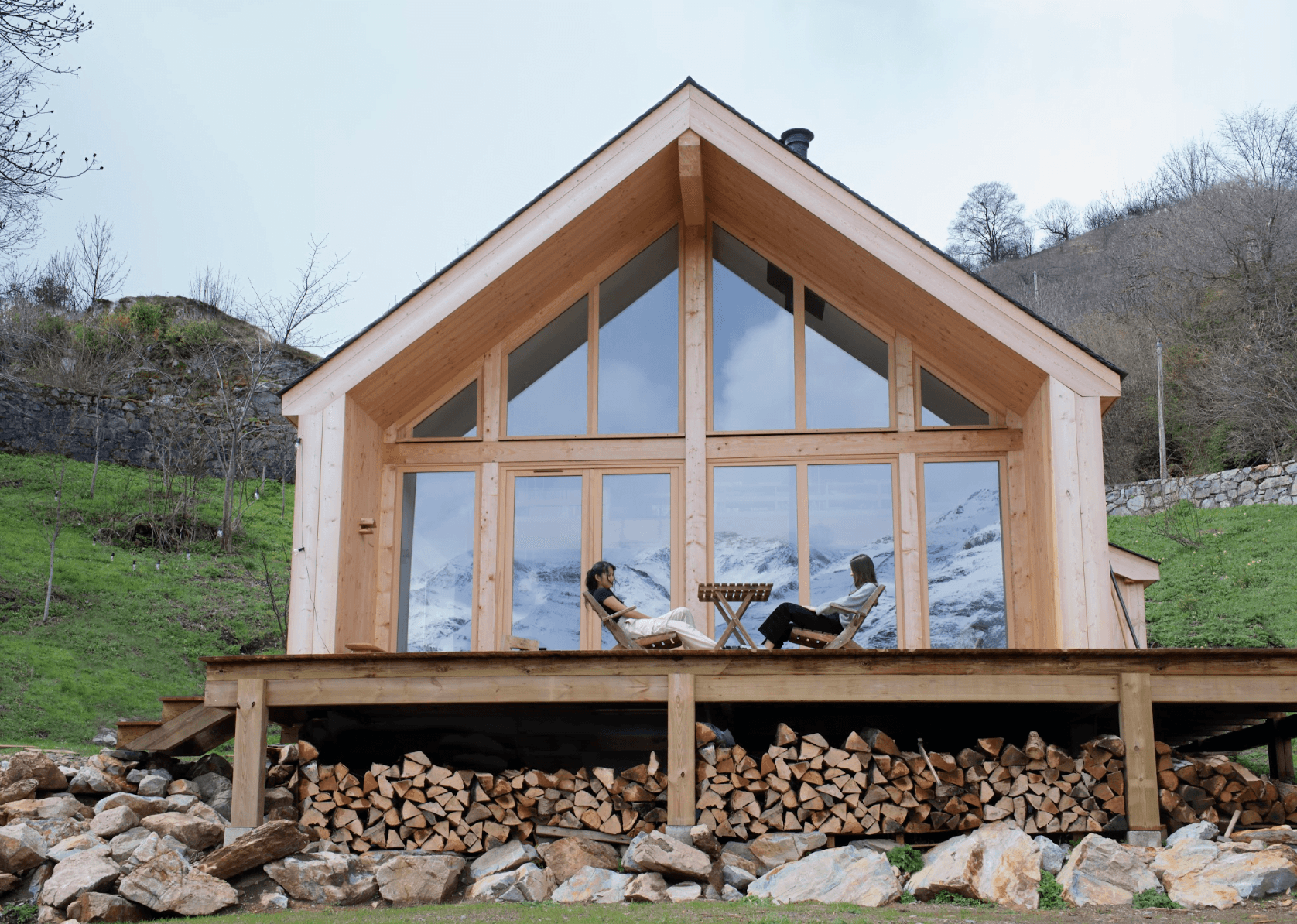 The glass bay window and terrace of La Maison Refuge