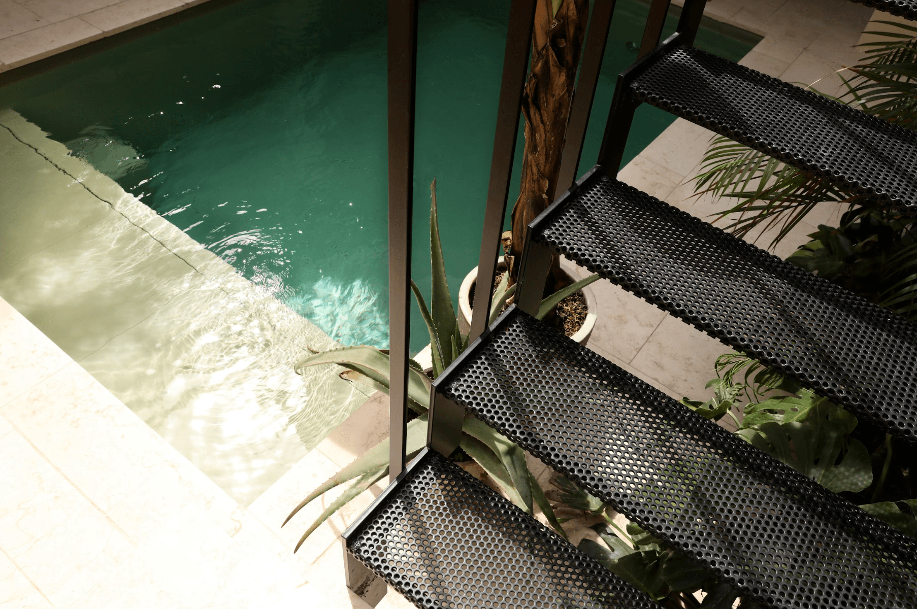The stairs leading to the bedroom and bathroom