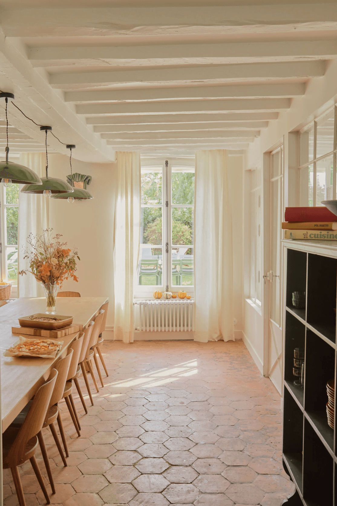 Dining table in the kitchen, terracotta floor tiles