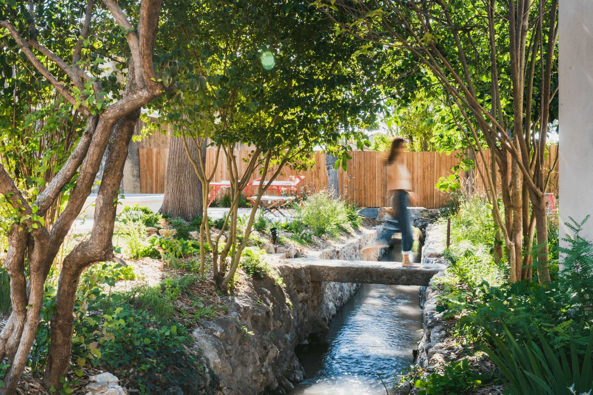 Aqui's garden: small stream, stone bridge, trees, and lawn