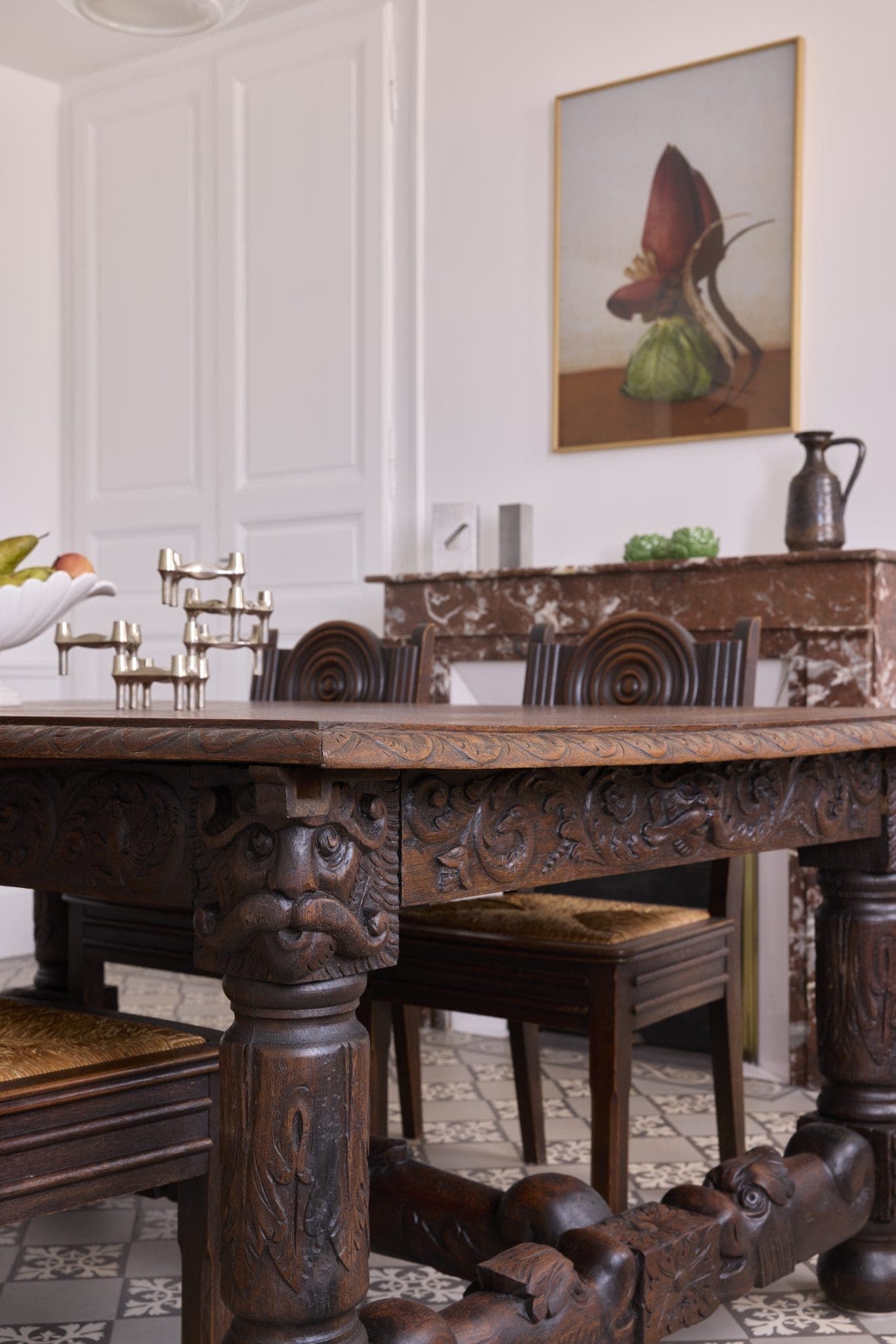 The 18th-century sculpted wooden table that takes pride of place in the dining room.