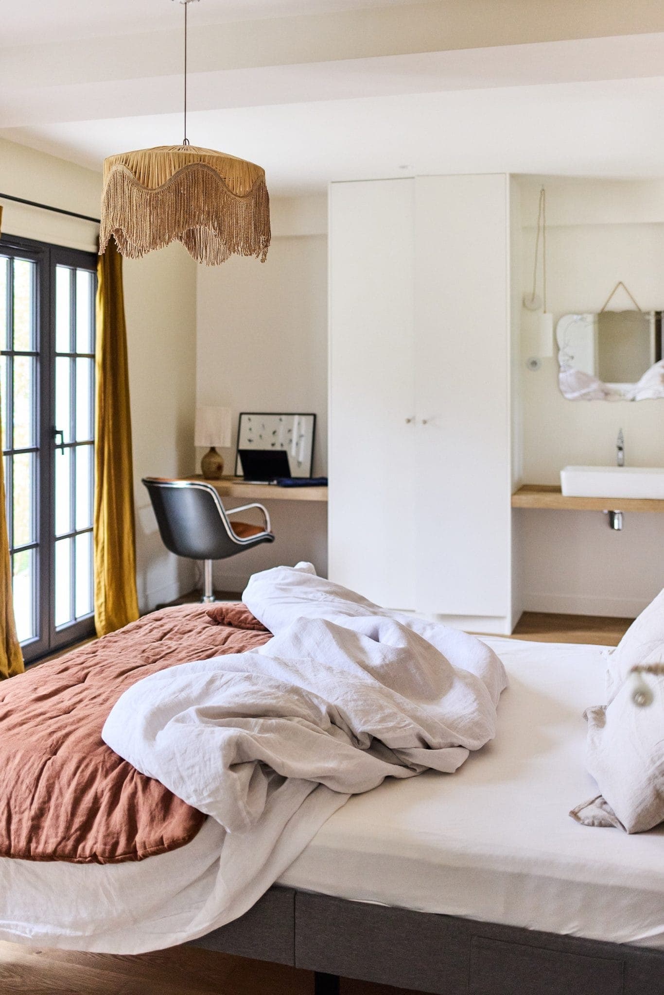 The cosy bedroom and office of Maison AJAE. 