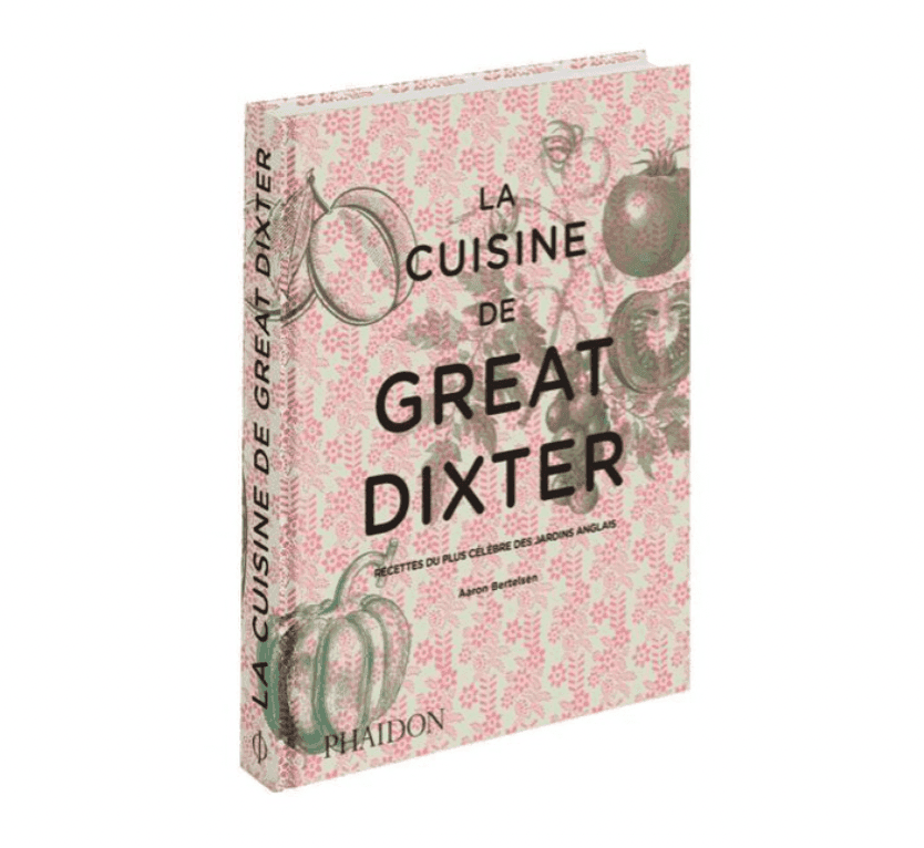 Couverture du livre « La Cuisine de Great Dixter » d'Aaron Bertelsen, ornée d'un fond floral rose et blanc complexe, avec des illustrations de légumes. Le titre et le nom de l'auteur sont bien visibles. Publié par Phaidon.