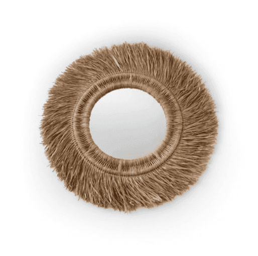 Miroir décoratif rond avec une bordure à franges en forme de paille.
