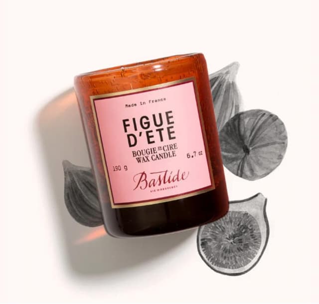 packshot of a wax candle with pink label