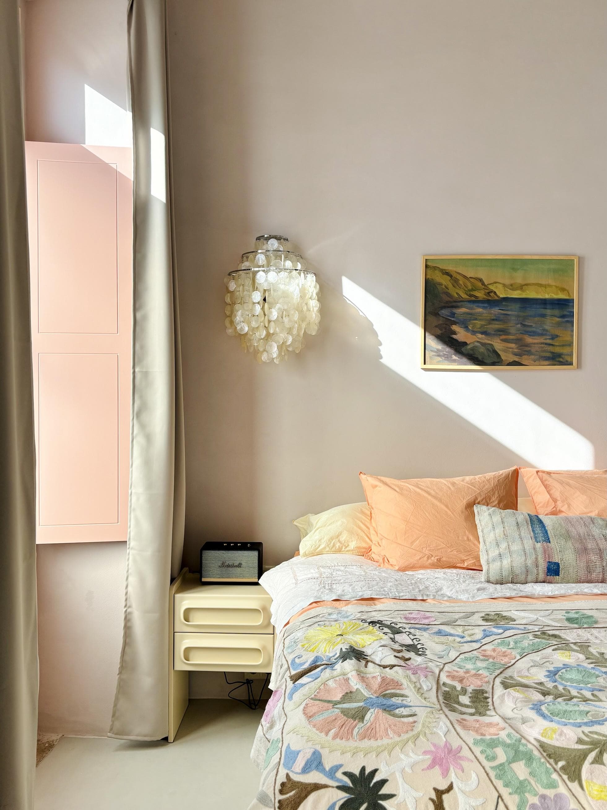 The charming pastel-hued bedroom.