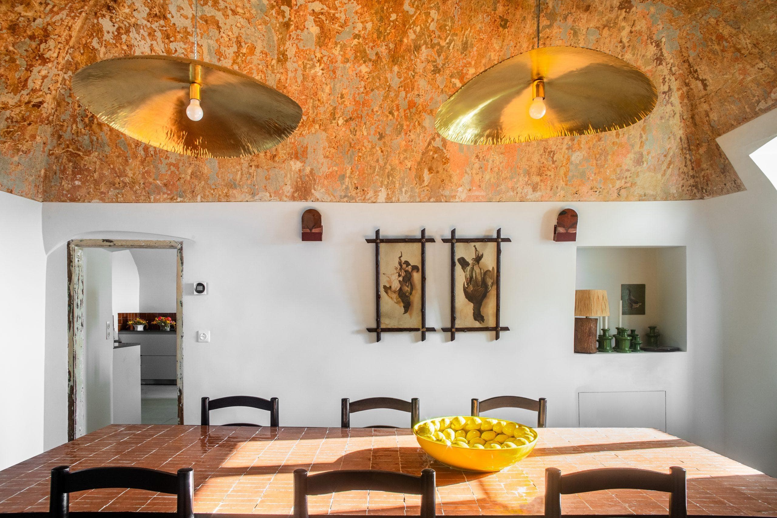 Charming dining room with golden pendant lights