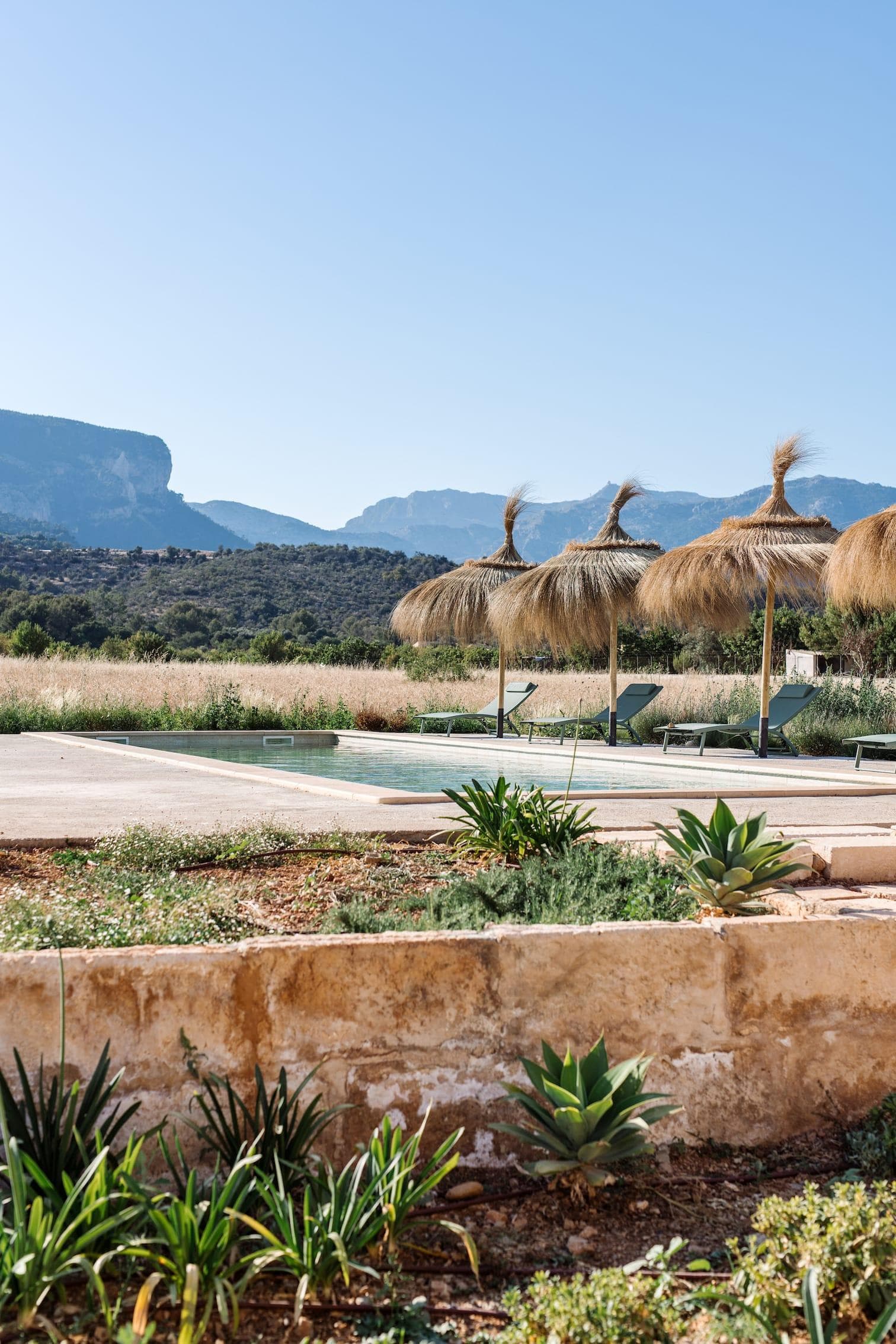 Between the mountains and hills, Casa Mana comes into view.