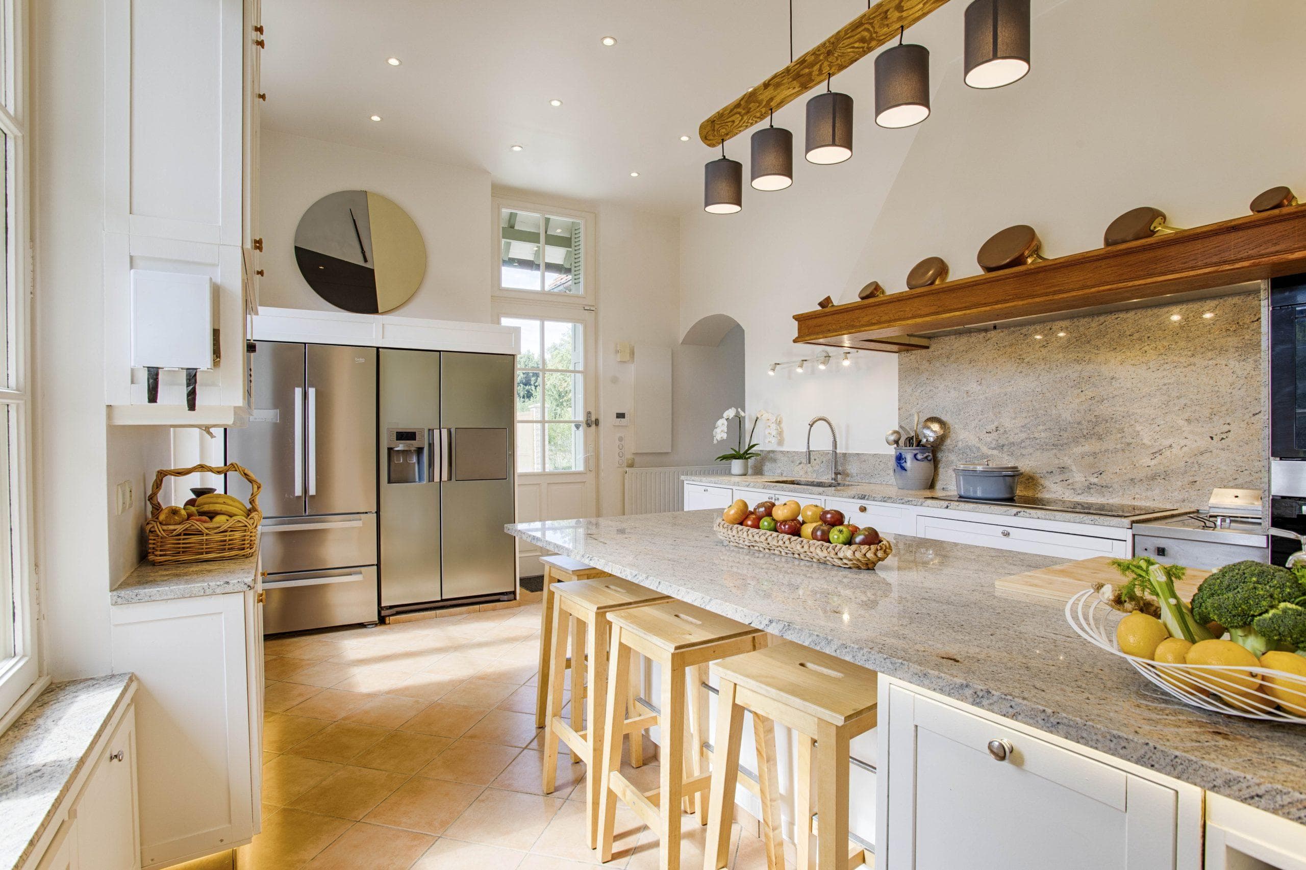 The kitchen with a central island in the main house of the Abbey, a perfect gathering spot for family reunions.