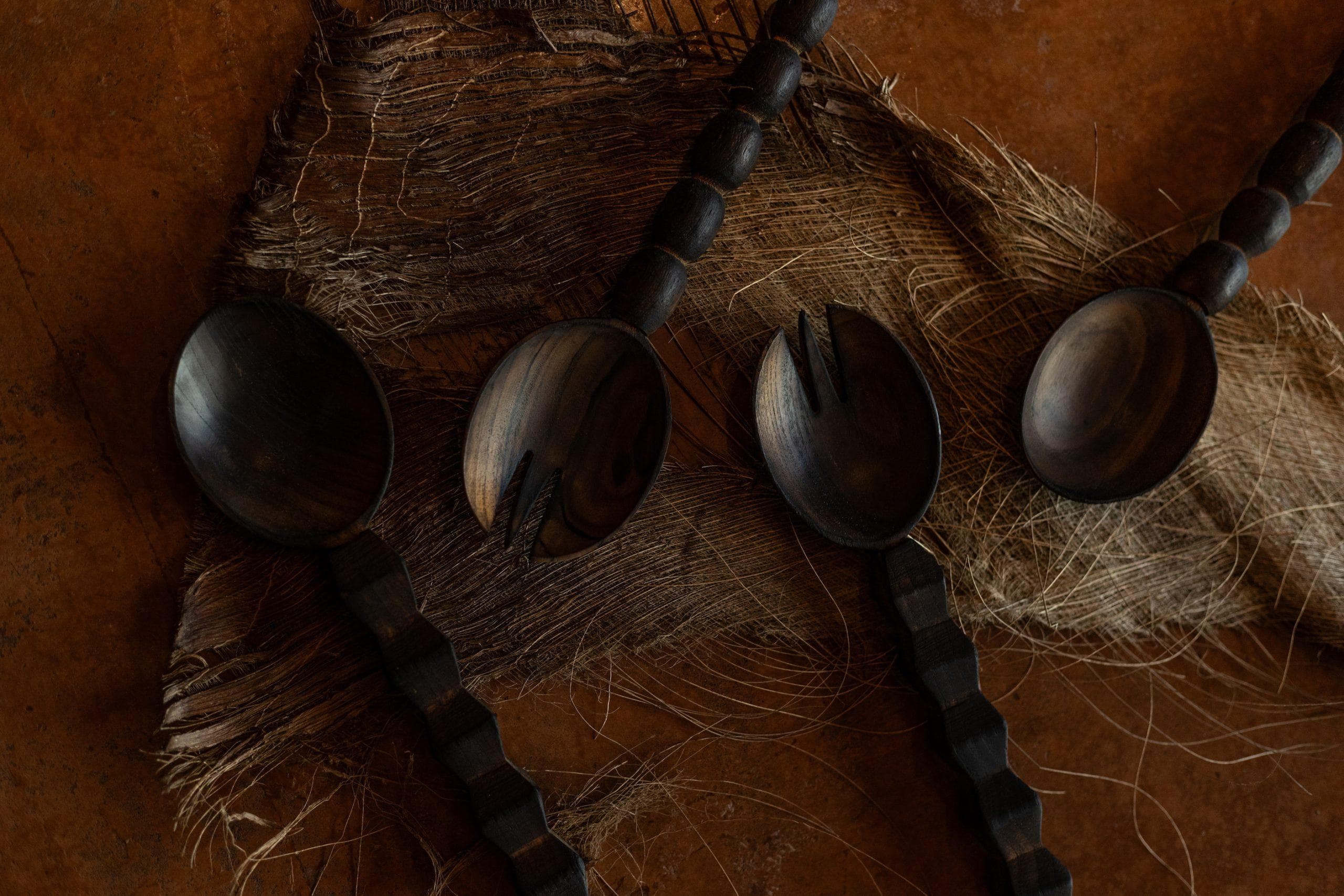 Woodmata burnt wood salad servers.