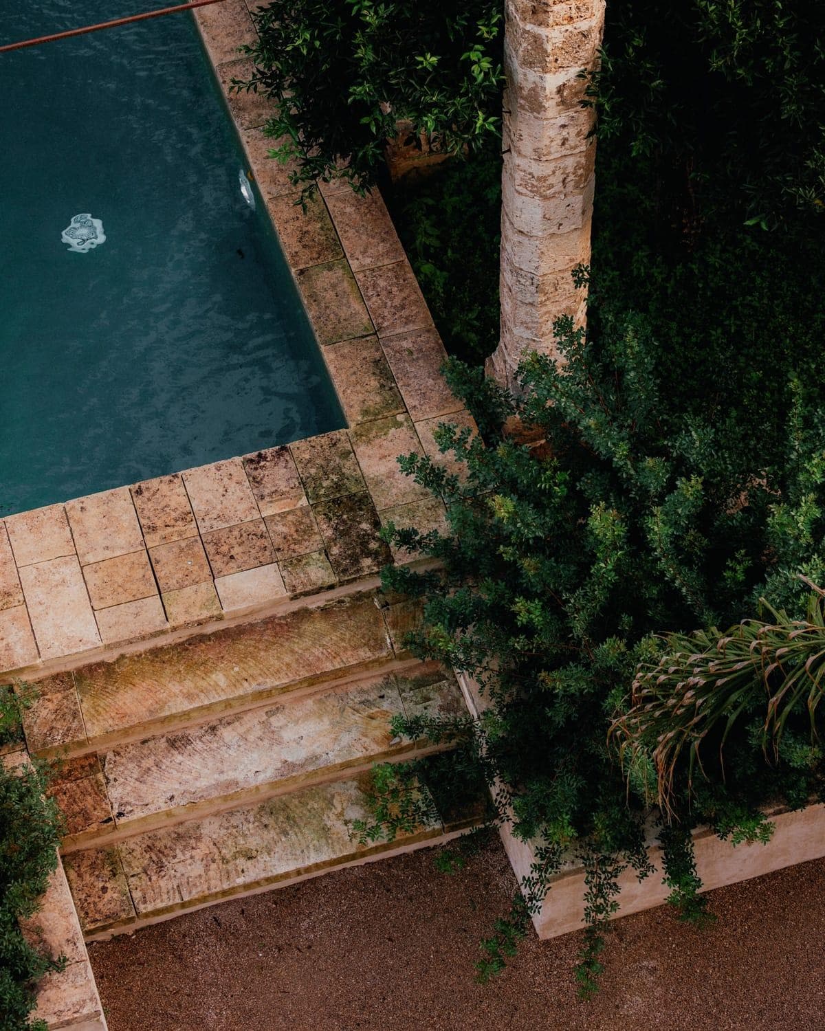 The stone pool nestled between columns and lemon trees. © Joe Clarke