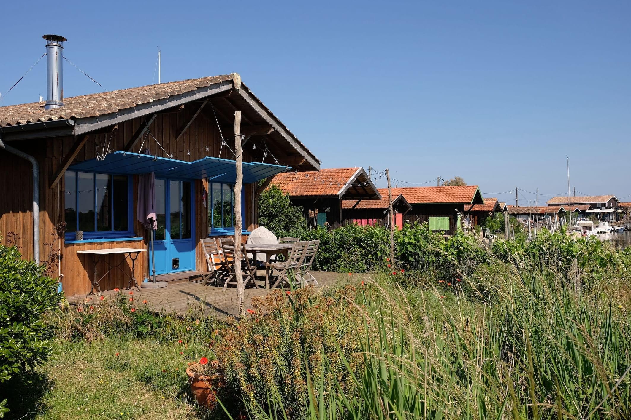 La Cabane des Barbots Bleus surrounded by its neighbors.