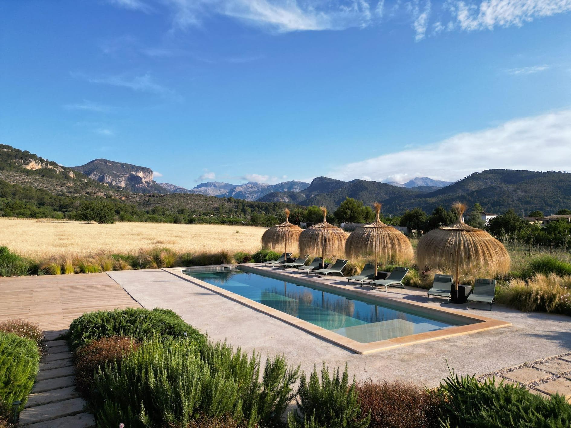The finca's pool, nestled between fields and mountains.