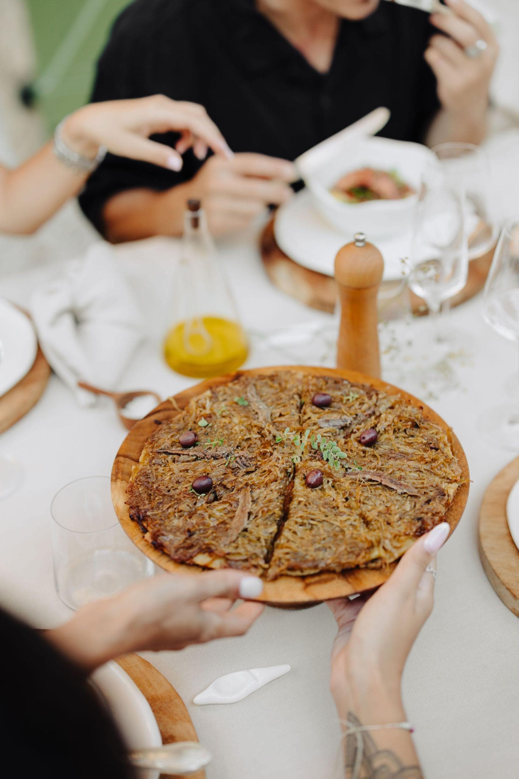 A local specialty at Maison Mastrorelli's table: pissaladière. © Coline Ciais-Soulhat