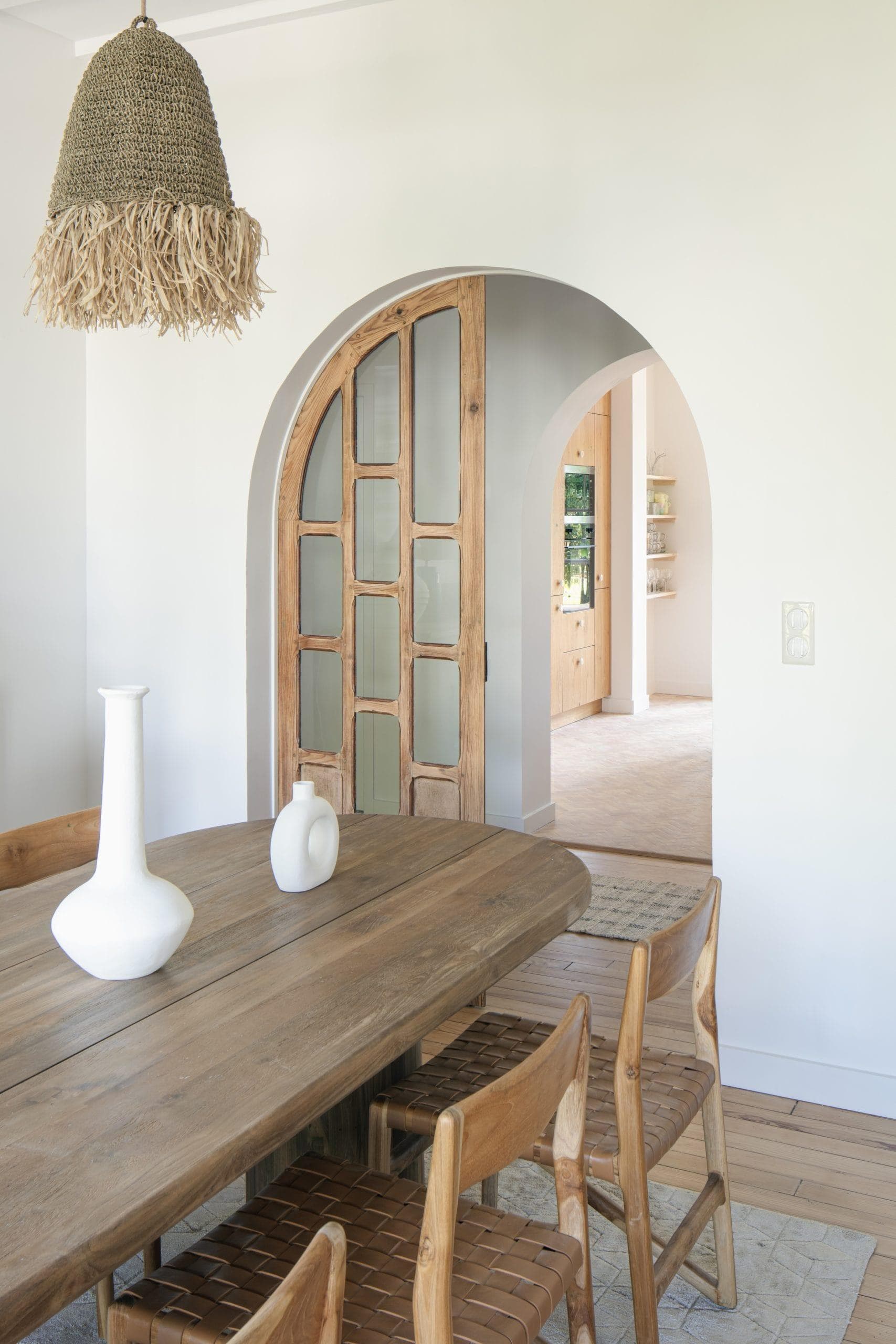 The showstopper in the dining room? The arched wooden door.