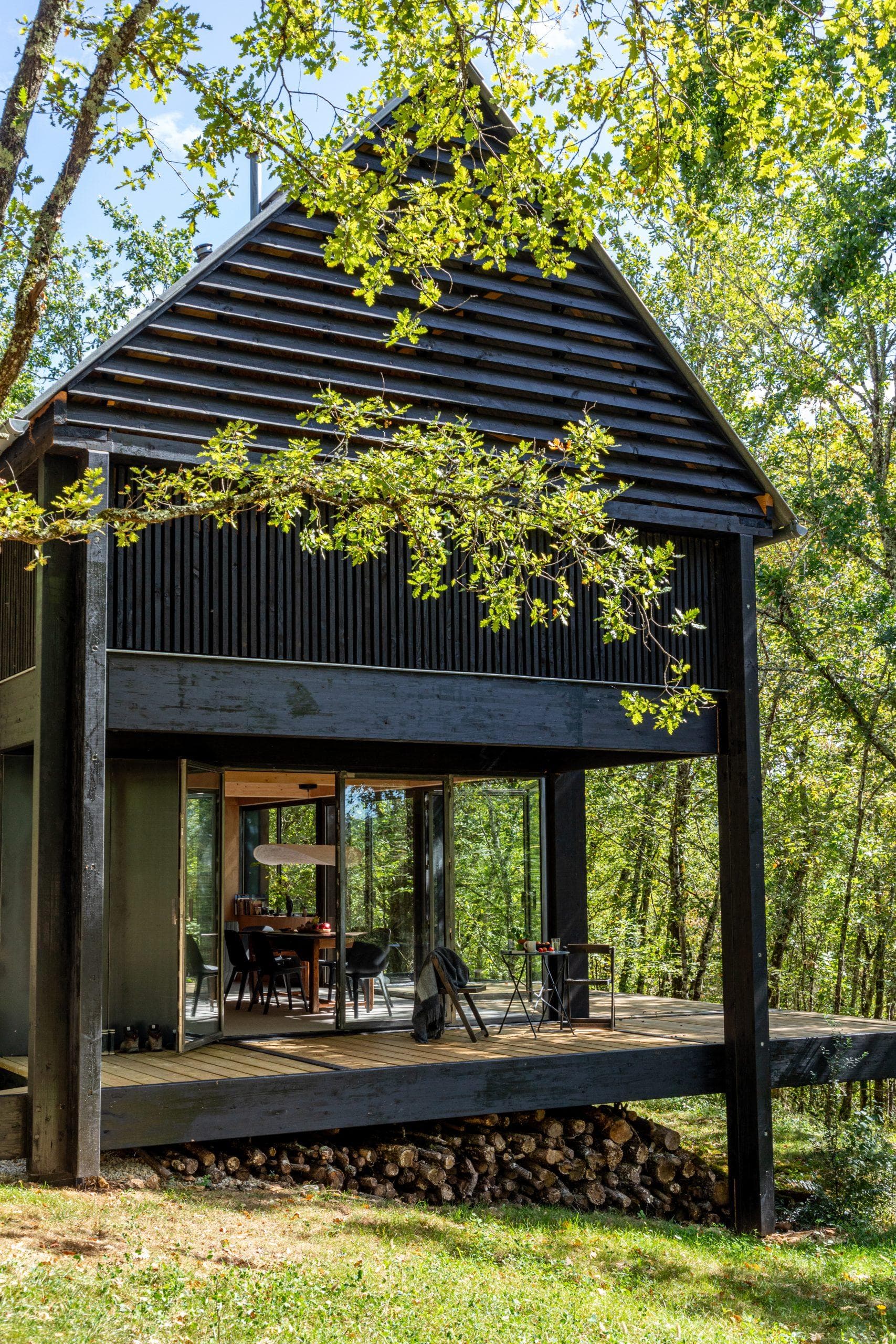 La Petite Maison Noire nestled in an oak forest.