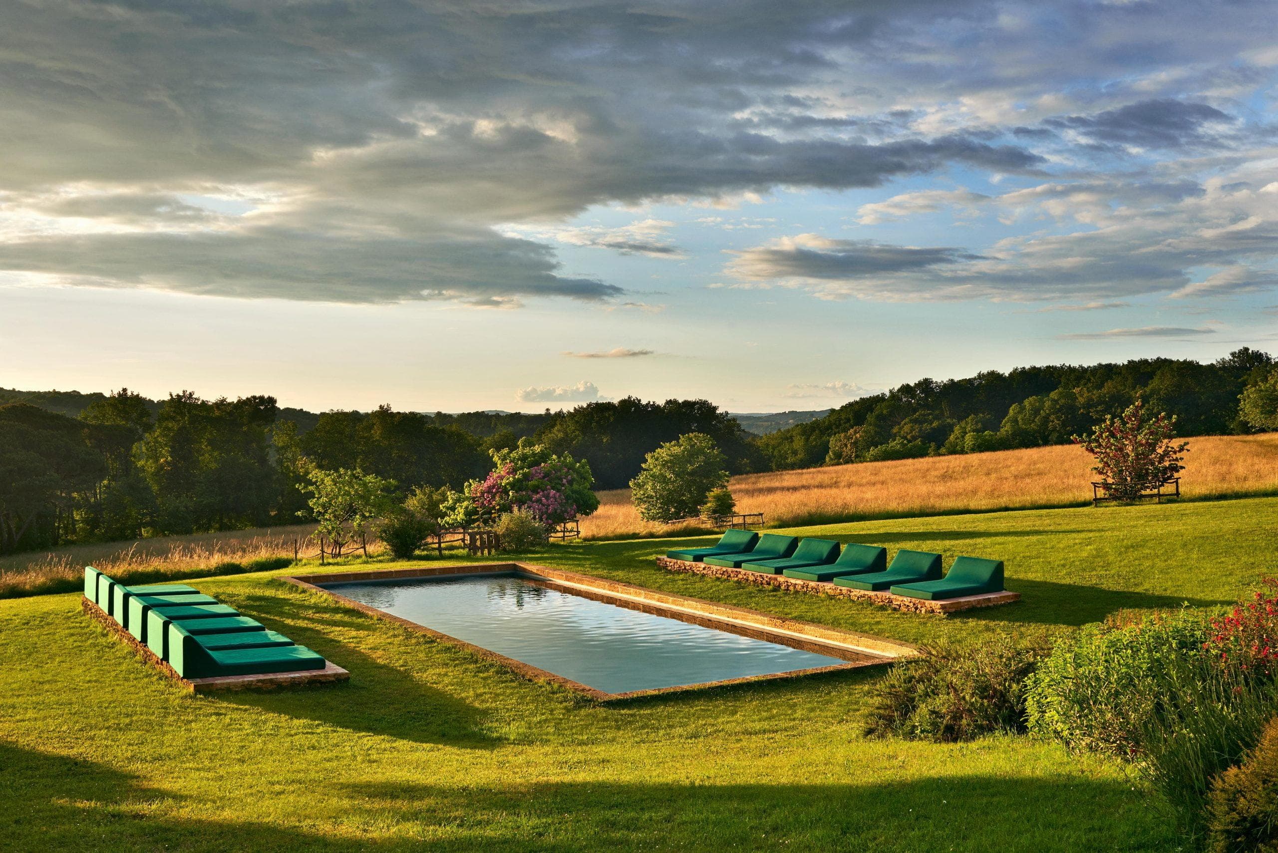 view of the swimming pool and the many sun loungers