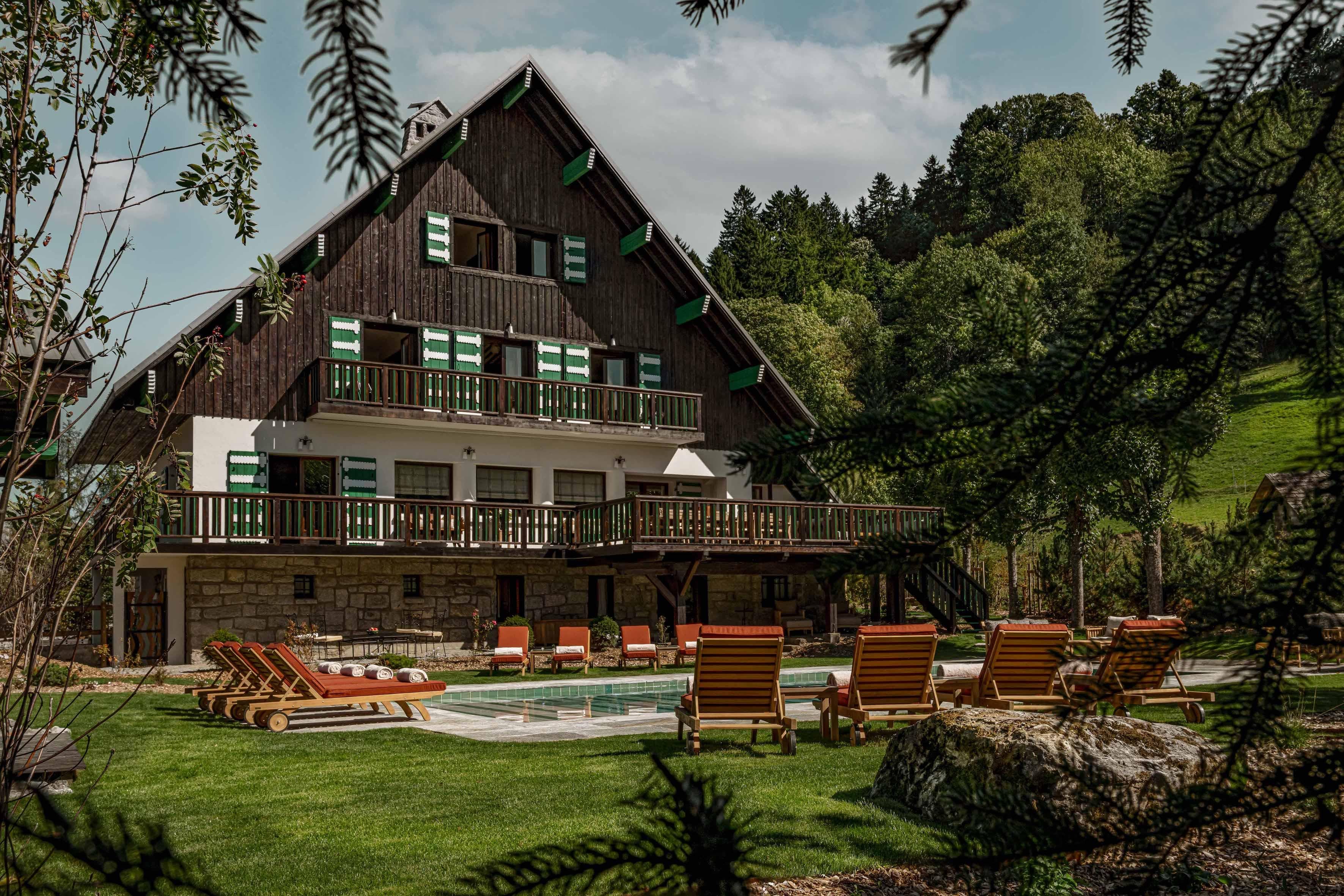 From outside Chalet Le Sarto, the pool sparkles under the Alpine sun.