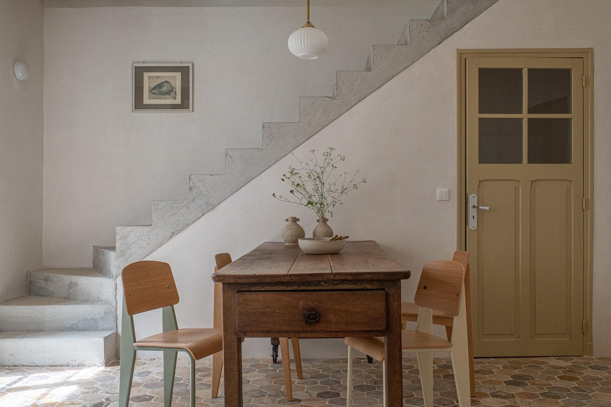 Farmhouse table and designer chairs
